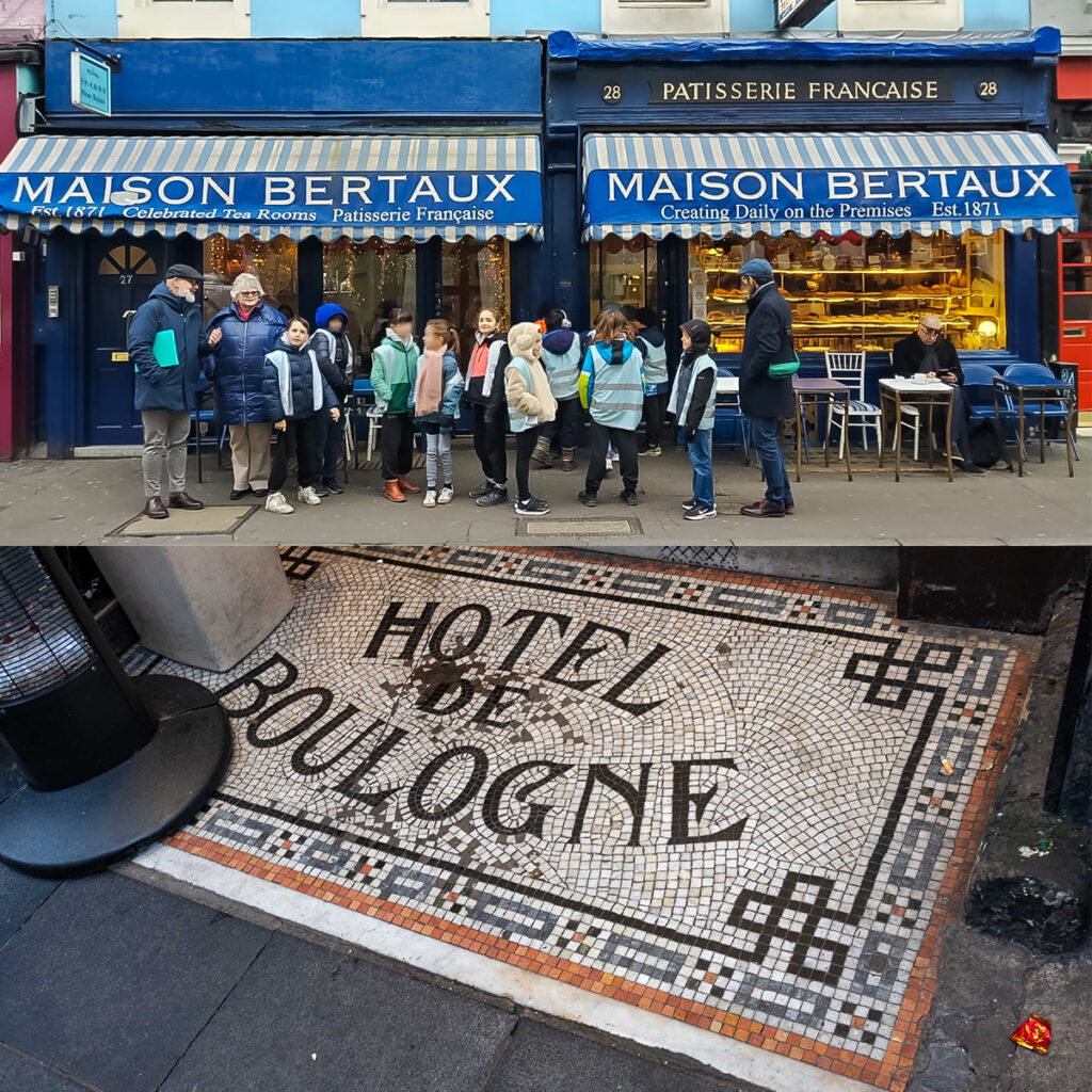 EIFA A group of people stands in front of Maison Bertaux, a pâtisserie with a blue facade and striped awnings. They are looking at the shop window. The sidewalk features a tiled design with the words HOTEL DE BOULOGNE.